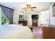 Bright bedroom with a large window, a ceiling fan, and traditional furnishings at 2505 Northlake Court Northeast, Atlanta, GA 30345