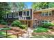 Charming townhome featuring a brick facade, complemented by mature landscaping and a welcoming walkway at 2505 Northlake Court Northeast, Atlanta, GA 30345