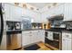 Well-lit kitchen featuring white cabinets, stainless steel appliances, and a stylish backsplash at 2505 Northlake Court Northeast, Atlanta, GA 30345