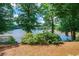 Picturesque view of a serene lake framed by lush green trees at 2505 Northlake Court Northeast, Atlanta, GA 30345