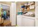 Laundry room featuring washer, dryer and view of a living space with a fireplace at 2505 Northlake Court Northeast, Atlanta, GA 30345