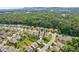Community aerial view showing houses, landscaping, and mature trees in the neighborhood at 4020 Huron Dr, Cumming, GA 30028