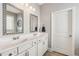 Bathroom featuring double sinks, stylish mirrors and lighting at 4020 Huron Dr, Cumming, GA 30028