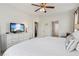Spacious bedroom with ceiling fan, TV, and ample natural light at 4020 Huron Dr, Cumming, GA 30028