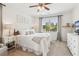 Bright bedroom featuring a ceiling fan, a large window and neutral-toned décor at 4020 Huron Dr, Cumming, GA 30028
