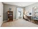 Well-lit bedroom features neutral paint, carpet, and a view of the neighborhood at 4020 Huron Dr, Cumming, GA 30028