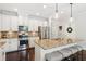 Modern kitchen with stainless steel appliances, granite countertops, and a large island with seating at 4020 Huron Dr, Cumming, GA 30028