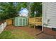 Spacious backyard featuring a shed and elevated wood deck with ample room for enjoying the outdoors at 683 Terry Se St, Atlanta, GA 30315