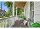 Relaxing balcony featuring wicker chairs, a wooden deck, and lush green surroundings with natural light at 683 Terry Se St, Atlanta, GA 30315