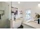 Bathroom features a modern tub, glass enclosed shower, and double vanity with contemporary fixtures at 683 Terry Se St, Atlanta, GA 30315
