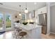 Modern kitchen with stainless steel appliances, island, and backyard access at 683 Terry Se St, Atlanta, GA 30315