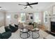 Comfortable living room with a fireplace, ceiling fan, and a neutral color palette at 683 Terry Se St, Atlanta, GA 30315