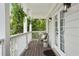 Charming outdoor patio with a chair and table, offering a relaxing space surrounded by lush greenery at 683 Terry Se St, Atlanta, GA 30315