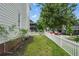 A grassy yard enclosed by a charming white picket fence, providing curb appeal and a sense of home at 683 Terry Se St, Atlanta, GA 30315