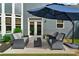 Backyard patio with comfortable seating and shade umbrella at 525 Wallis Farm Ln, Marietta, GA 30064