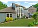 Backyard with lush lawn, landscaping, hardscape patio and outdoor seating at 525 Wallis Farm Ln, Marietta, GA 30064