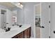 Bathroom featuring dual sinks, dark cabinets, large mirrors, and modern fixtures at 525 Wallis Farm Ln, Marietta, GA 30064