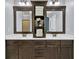 Bathroom featuring dual vanity sinks with white countertops and dark wood cabinets at 525 Wallis Farm Ln, Marietta, GA 30064