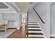 Spacious foyer with hardwood floors, elegant staircase, and wainscoting offers a grand entrance to the home at 525 Wallis Farm Ln, Marietta, GA 30064