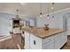 Spacious kitchen island with granite countertops, white cabinets, and seating at 525 Wallis Farm Ln, Marietta, GA 30064