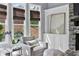 Bright sunroom featuring a stone fireplace, large windows, and hardwood floors at 525 Wallis Farm Ln, Marietta, GA 30064