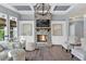 Cozy living room with a stone fireplace, hardwood floors, and coffered ceilings at 525 Wallis Farm Ln, Marietta, GA 30064