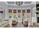 Bright living room featuring large windows, hardwood floors, and neutral furniture at 525 Wallis Farm Ln, Marietta, GA 30064