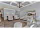 Open-concept living room with hardwood floors, neutral decor, and views of the kitchen at 525 Wallis Farm Ln, Marietta, GA 30064