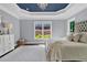 Comfortable main bedroom features a plush bed, and views of the outdoors through multiple windows at 525 Wallis Farm Ln, Marietta, GA 30064