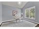 Bright office space with vaulted ceilings, large windows, decorative rug and a modern chandelier at 525 Wallis Farm Ln, Marietta, GA 30064