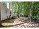 Spacious backyard with mature trees providing ample shade, creating a serene outdoor space at 6788 Oakhurst Court Ct, Douglasville, GA 30134