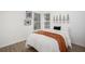 Cozy bedroom with natural light, a comfortable bed, and minimalist decor at 6788 Oakhurst Court Ct, Douglasville, GA 30134