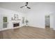 Bright living room with vaulted ceilings, fireplace, hardwood floors, and access to the outdoors at 6788 Oakhurst Court Ct, Douglasville, GA 30134