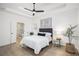 Inviting main bedroom featuring a tray ceiling, neutral palette, and ensuite bath access at 6788 Oakhurst Court Ct, Douglasville, GA 30134