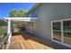 Back exterior showing a covered porch, multiple windows and wood deck at 11 Trotters Ne Walk, Cartersville, GA 30121