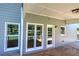 Covered porch and home exterior with windows looking out on the backyard at 11 Trotters Ne Walk, Cartersville, GA 30121