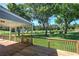Wide wooden deck looking out over the serene fenced backyard and lush greenery at 11 Trotters Ne Walk, Cartersville, GA 30121