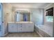 Bright bathroom with double vanity, soaking tub, and large mirror providing ample space at 11 Trotters Ne Walk, Cartersville, GA 30121