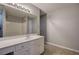 Bathroom featuring a large mirror, bright vanity, and a shower/tub at 11 Trotters Ne Walk, Cartersville, GA 30121