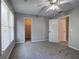Carpeted bedroom featuring a window and doors to an adjacent room and closet at 11 Trotters Ne Walk, Cartersville, GA 30121