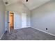 Bedroom with vaulted ceiling, neutral carpeting, and access to adjacent rooms at 11 Trotters Ne Walk, Cartersville, GA 30121