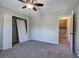 Bedroom featuring gray walls, closet space, and a doorway to an adjacent room at 11 Trotters Ne Walk, Cartersville, GA 30121