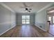 Dining room with ceiling fan, wood-look floors and access to deck at 11 Trotters Ne Walk, Cartersville, GA 30121