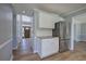 Welcoming entryway featuring a modern chandelier, a dark wood door, and stylish flooring at 11 Trotters Ne Walk, Cartersville, GA 30121