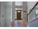Inviting front foyer with a wood door, sidelights, and wood-look flooring at 11 Trotters Ne Walk, Cartersville, GA 30121