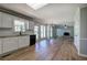 Open-concept kitchen with stainless appliances, granite counters, and wood-look floors at 11 Trotters Ne Walk, Cartersville, GA 30121