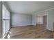 Sunlit living room featuring wood-look floors and large windows at 11 Trotters Ne Walk, Cartersville, GA 30121