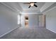 Spacious main bedroom with trey ceiling, carpeted floors, and large windows at 11 Trotters Ne Walk, Cartersville, GA 30121