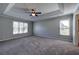 Large main bedroom with trey ceiling, neutral walls, and carpeted floors at 11 Trotters Ne Walk, Cartersville, GA 30121