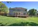 Exterior of home with an expansive backyard and a private wooden deck at 11 Trotters Ne Walk, Cartersville, GA 30121